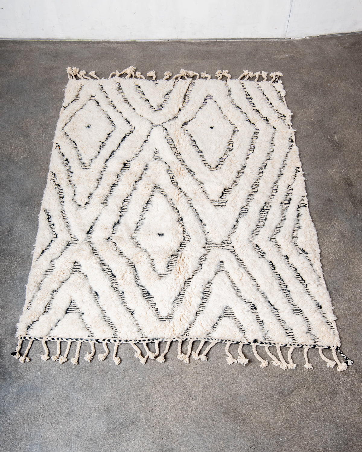 Modern, designer, handcrafted Berber rug from Morocco. Beniourain carpet with minimalist design, natural wool pile and a fluffy texture.